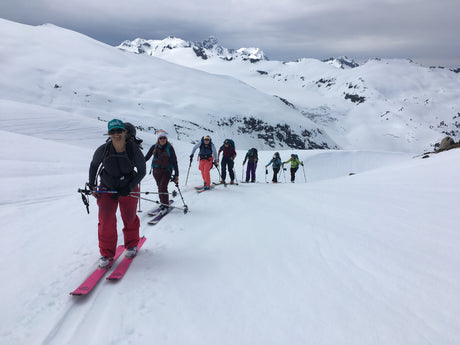 people ski touring