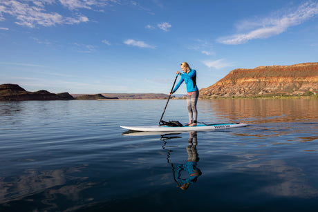 person paddleboarding