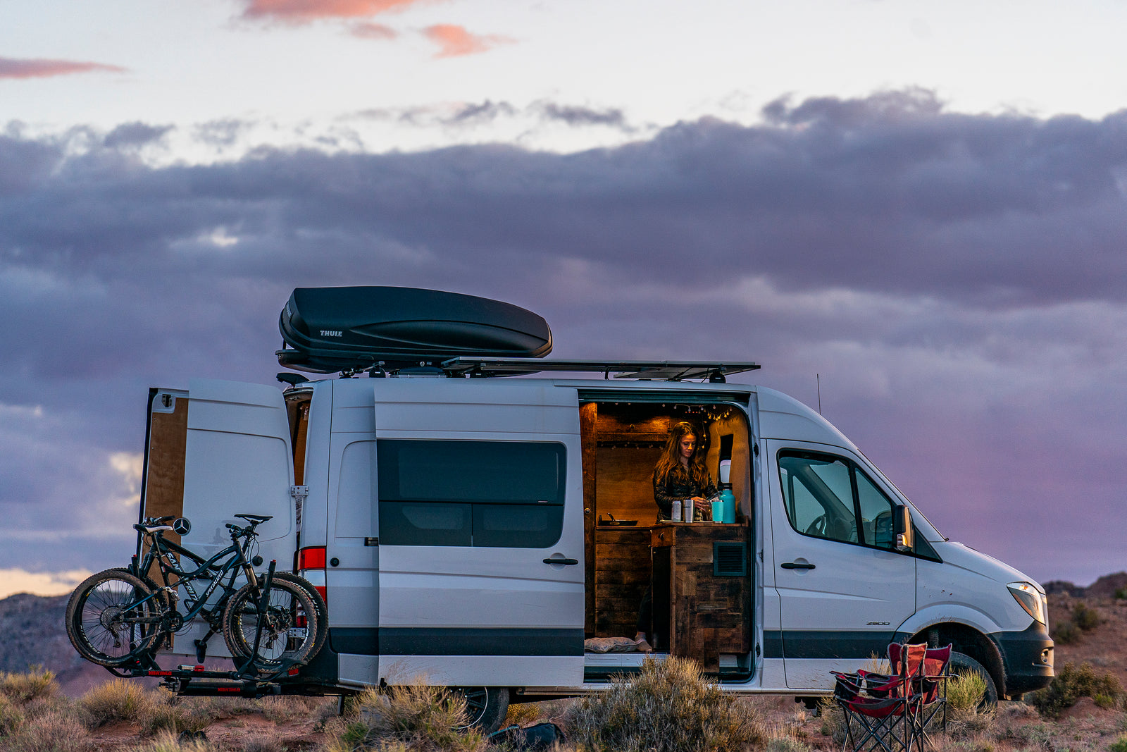people camping in a van